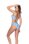 A supportive and romantic silhouette in a charming eyelet print, this two-piece swimsuit features a cami bikini top with a back tie and ruffle shoulder straps. The matching bottom has side drawstrings, allowing you to wear it mid or high-waisted.