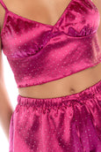 Add a touch of luxury to your nightwear. Two-piece satin set with rhinestone sparkles. Adjustable straps.